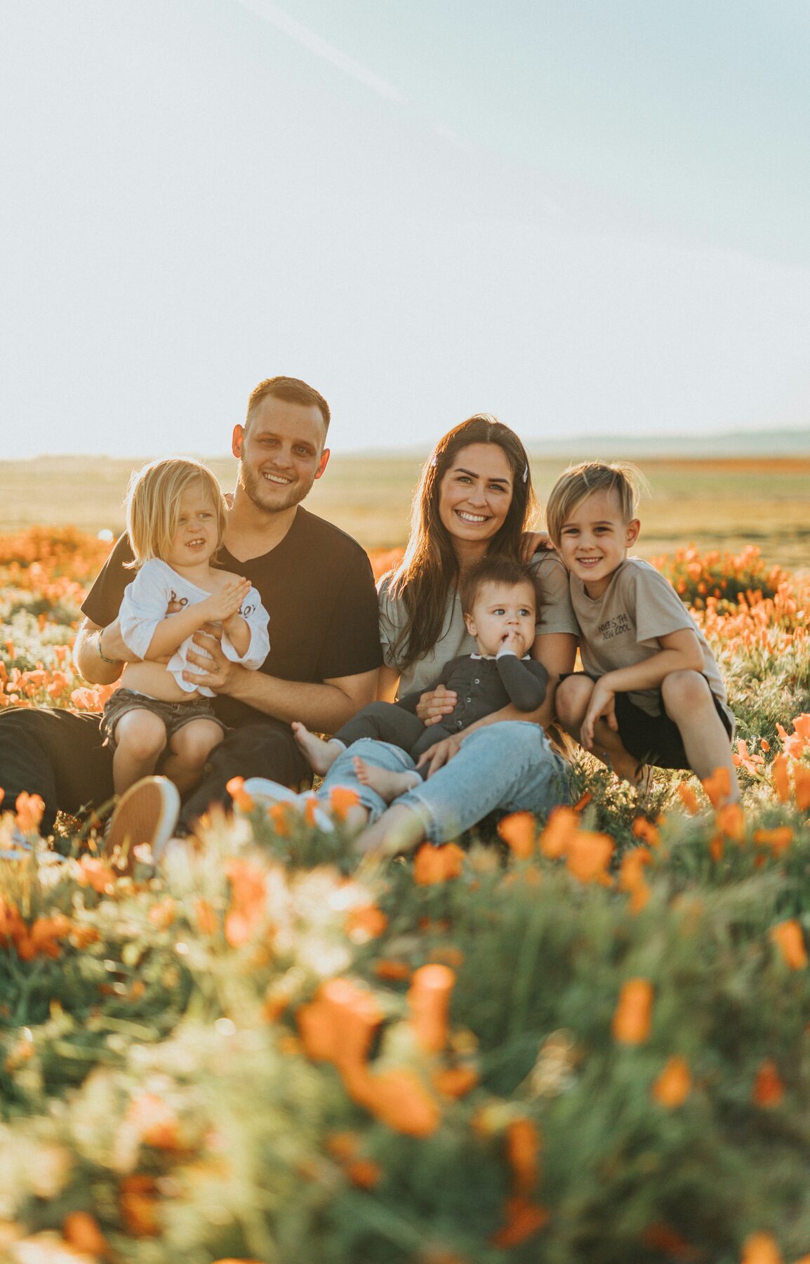 A family relaxing together in an eastern North Carolina wildflower field